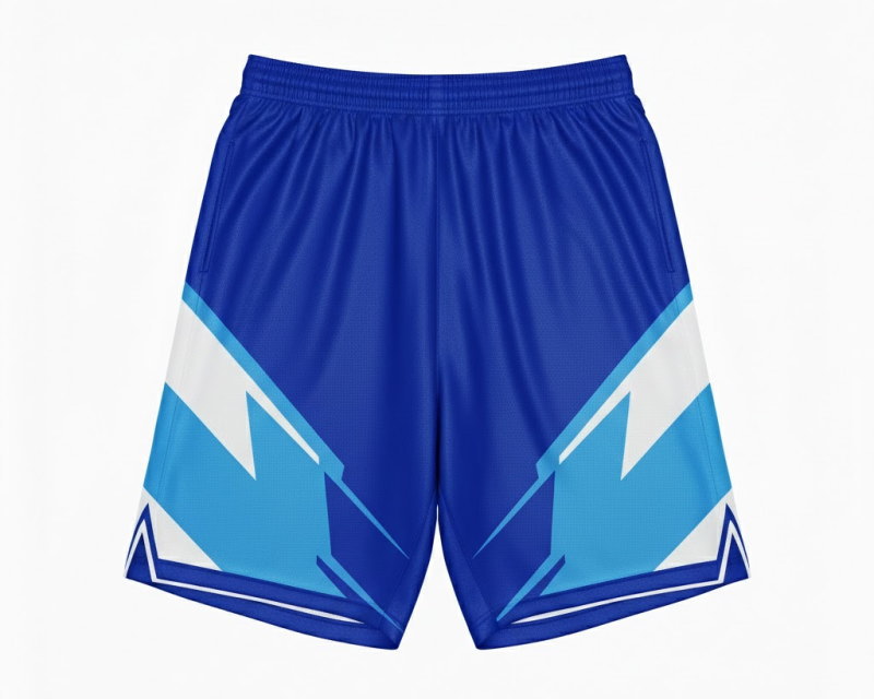 セットアップのオーダーメイドサッカーパンツ。シャツの稲妻グラフィックと連動した両サイドの青・水色・白のダイナミックなデザイン。